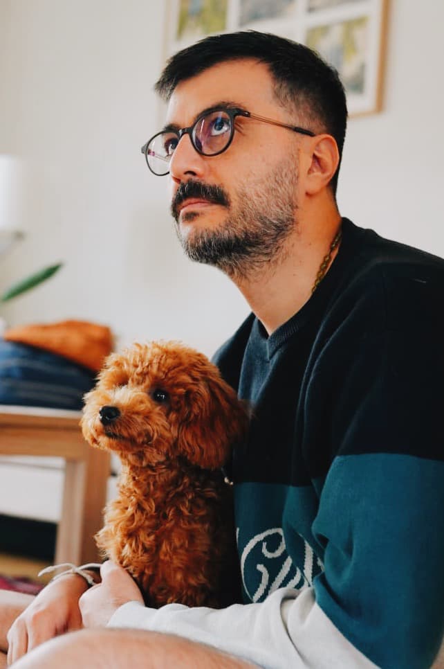 Mehran Bolhasani with his friend Lucky the dog